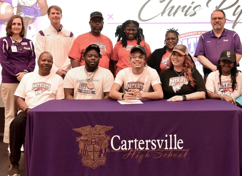 Surrounded by family, friends, and school administrators, Cartersville High senior Chris Ryan signed to play football at The University of the Cumberlands in Williamsburg, Kentucky.