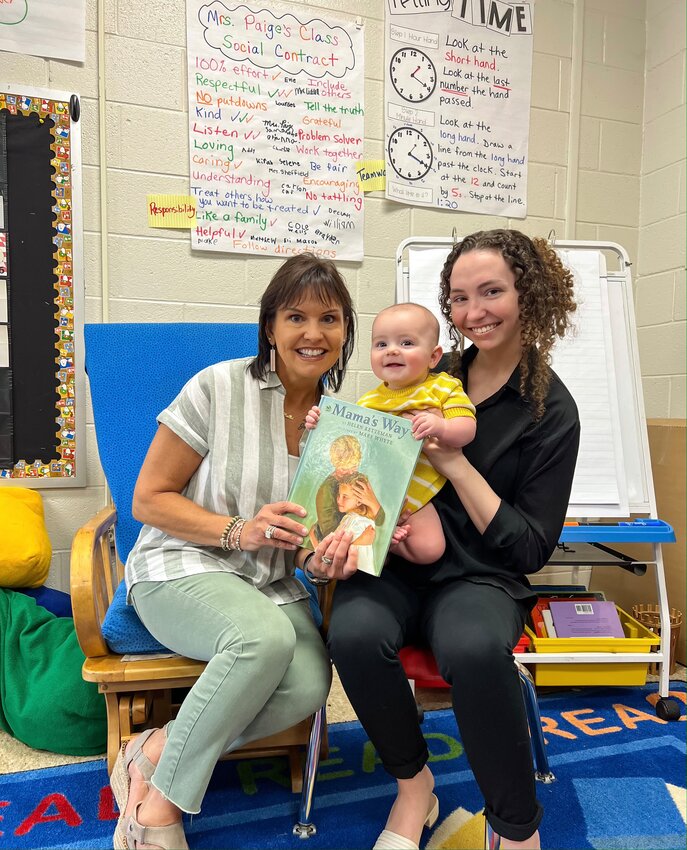 Melanie Paige, left, shares a smile with her daughter, Carsyn Bagwell, and grandson, Beck, in her second grade classroom at Cartersville Primary School.