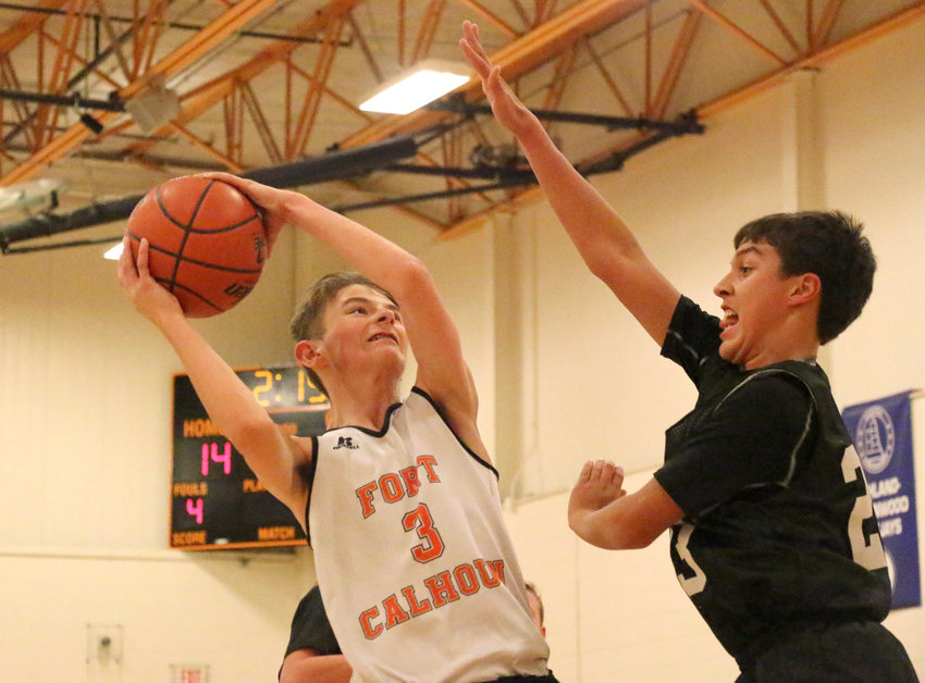 Pioneers eighth-grader Owen Newbold goes up for a shot Tuesday at Fort Calhoun High School.