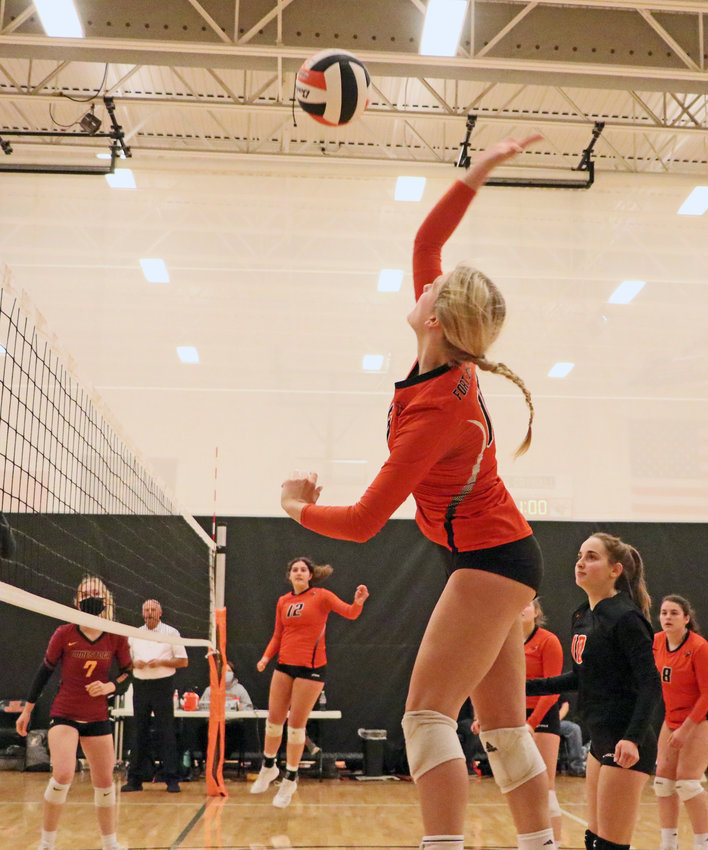 The Pioneers' Ellie Lienemann rises up for a spike Saturday at Fort Calhoun High School.