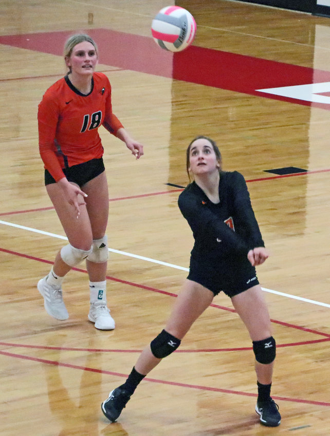 Fort Calhoun's McKenna Greenwell, right, makes a play on the ball as Ellie Lienemann watches Tuesday at Douglas County West.