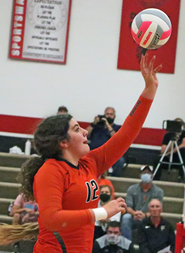 Fort Calhoun senior Alivia Cullen taps the ball over the net Tuesday at Douglas County West.