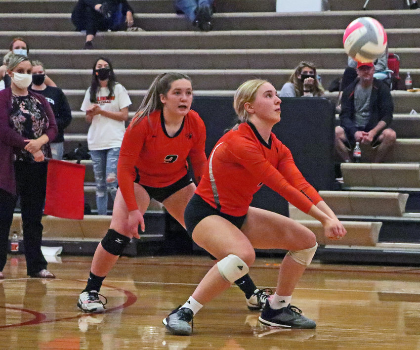 Fort Calhoun's Kaitlin Smith, right, makes a play on the ball in front of Mollie Dierks on Tuesday at Douglas County West.