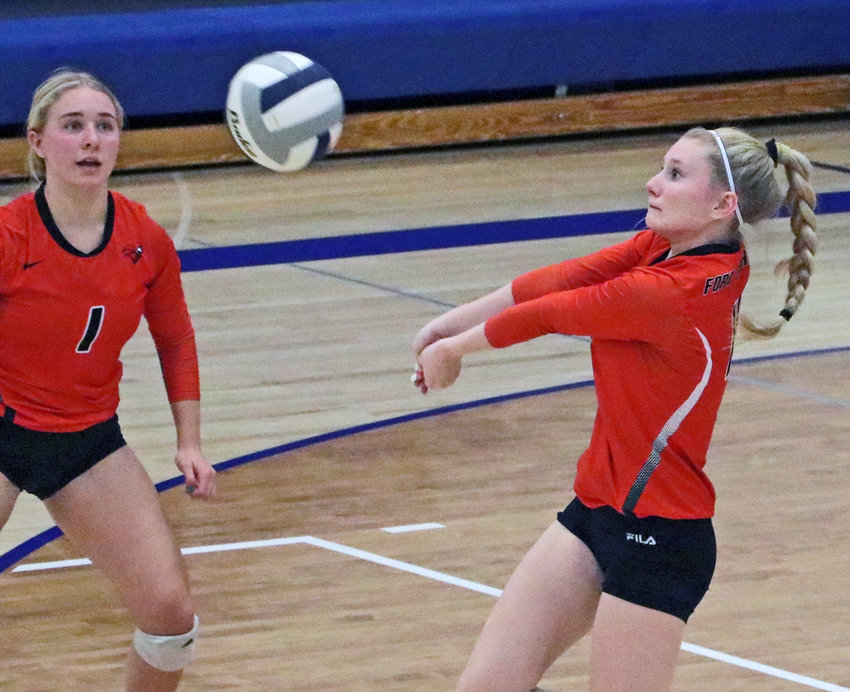 Fort Calhoun senior Kaitlin Smith, left, and Olivia Quinlan converge on the ball Monday at Wahoo High School.