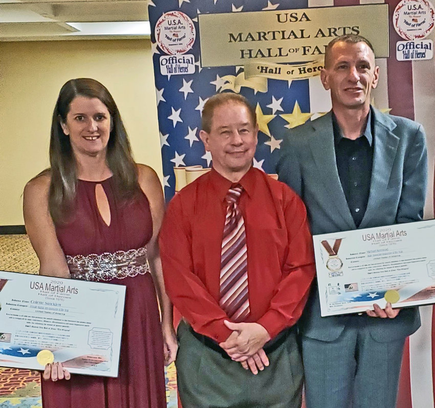 Colette Stricklett, owner and head instructor of Blair's Rosenbach Warrior Training Branch, poses for a photo with James Rosenbach, middle, and Blair instructor Mike Kermoade, right, recently during a USA Martial Arts Hall of Fame induction event. Stricklett and Kermoade were inducted for their efforts.