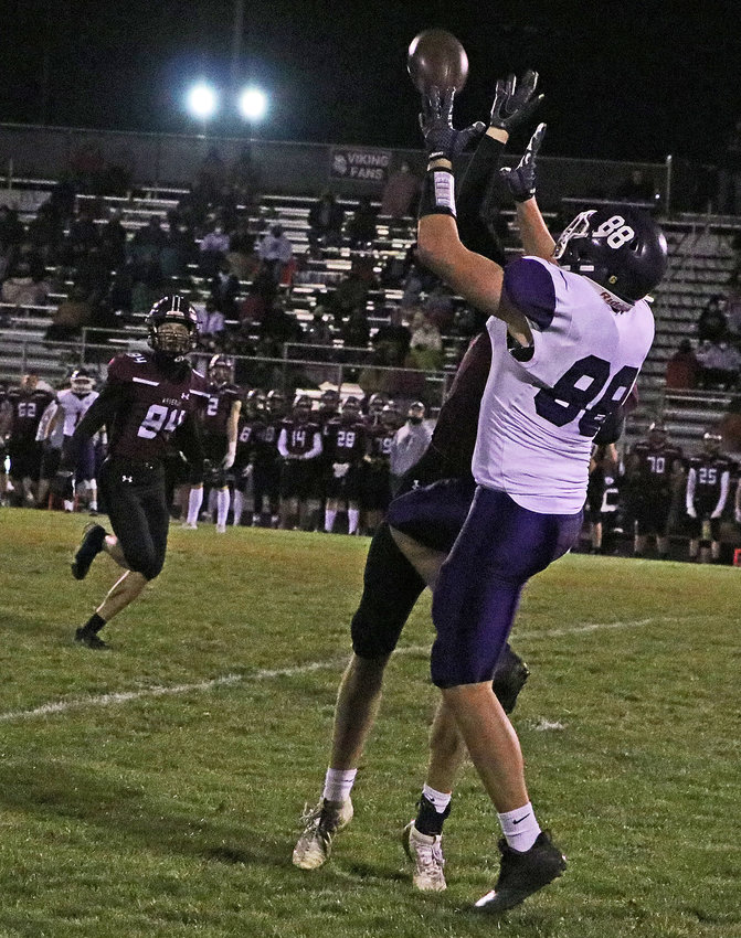 Blair senior Cade Ulven, right, makes a catch Friday during the second half at Waverly High School.