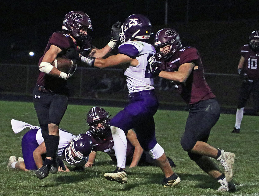 Blair's Livai Opetaia, middle, tracks down and brings down the Vikings' Zane Schawang on Friday at Waverly High School.