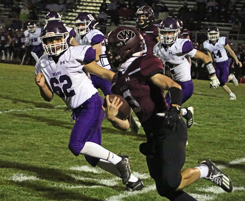 Blair sophomore Joe Rodriguez, left, and the Bears try to track down the Vikings' Nolan Wiese on Friday at Waverly High School.