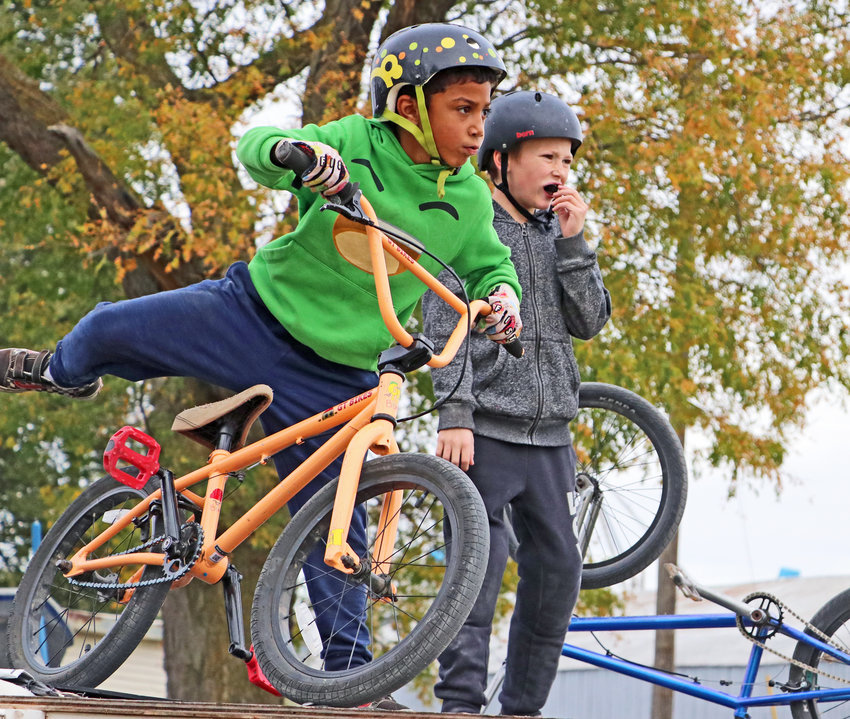Caden Butler, left, and Jordyn Farfalla get ready to drop-in onto their BMX ramp in mid-October.