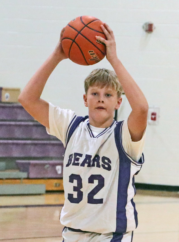 Bears eighth-grader Lucas Matejka looks to pass Monday at Otte Blair Middle School.