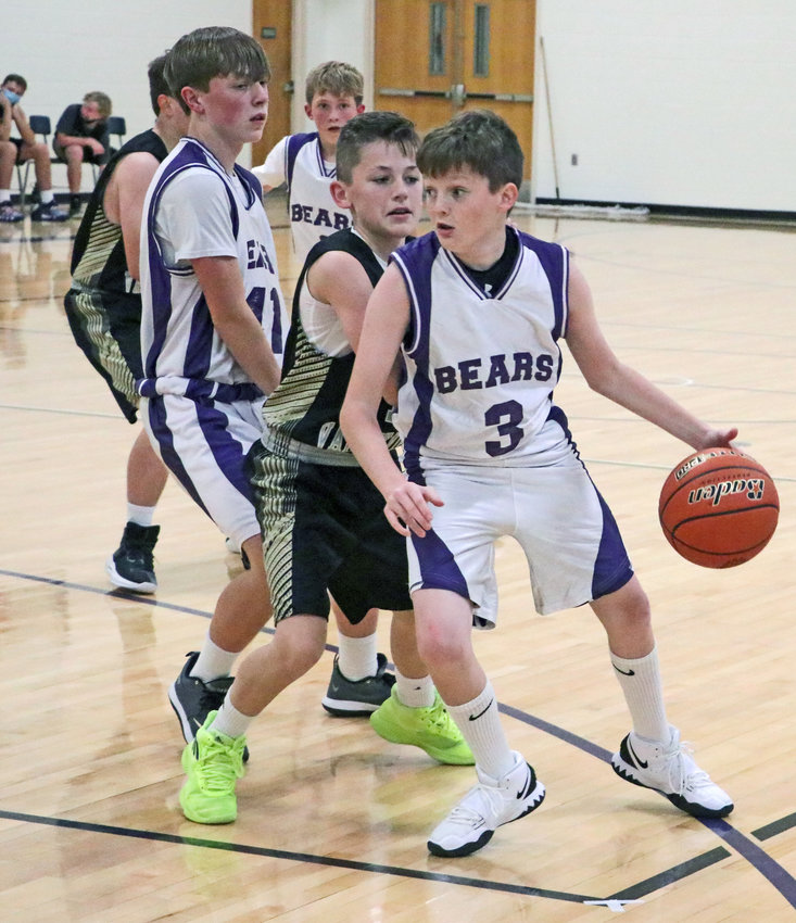 The Bears' Colton Flynn uses a screen by Jase Bensen on Monday at Otte Blair Middle School.