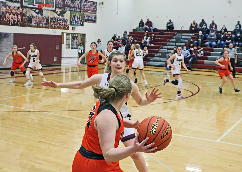 Fort Calhoun senior Rianna Wells inbounds the basketball as the Eagles' Kate Miller defends late during Friday's NCC Tournament consolation game at Arlington High School.