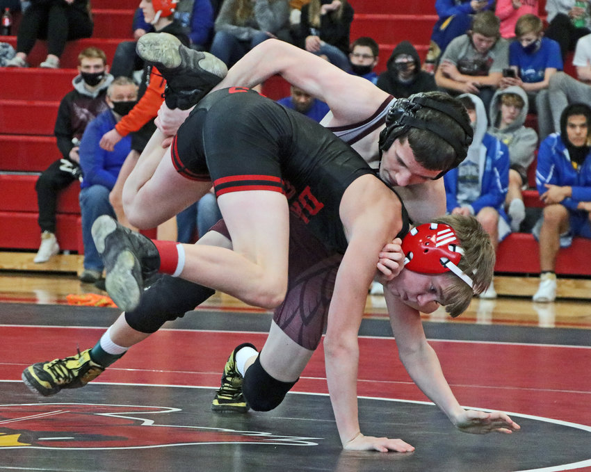 Arlington 106-pounder Trey Hill, top, controls his opponent Saturday at Albion Boone Central.