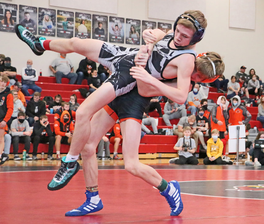 Fort Calhoun 113-pounder Ely Olberding, right, picks up his opponent Saturday at Albion Boone Central.