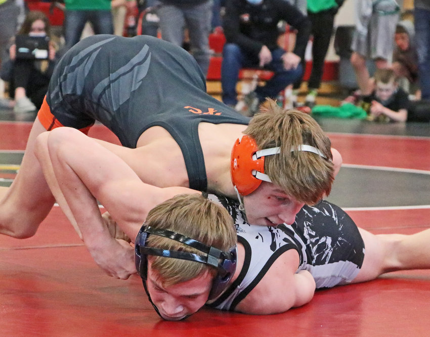 Fort Calhoun sophomore Ely Olberding, top, grounds his opponent Saturday during district competition at Albion Boone Central.