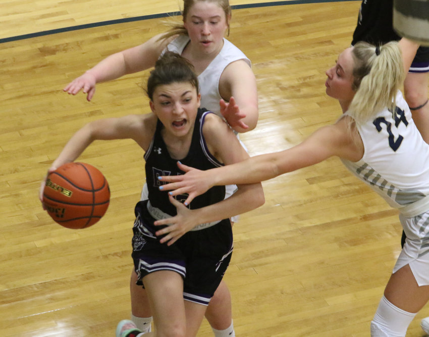 Sami Murray drives the baseline Saturday during third quarter action in York. York junior Mattie Pohl (24) tries to reach in on the drive.