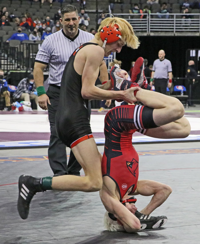 Fort Calhoun 120-pounder Lance Olberding, left, tries to pull Albion Boone Central's Gavin Dozler on Saturday during a third-place match in Omaha.