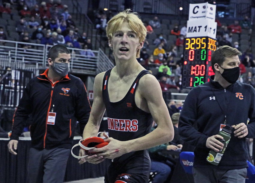 Fort Calhoun 120-pounder Lance Olberding looks out into the crowd after clinching a state medal.