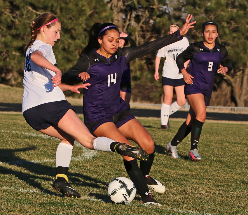 Blair midfielder Allison Hernandez, middle, contends for the ball with Omaha Mercy's Elizabeth Rosenthal, left, as Valeria Hernandez, right, watches Thursday at Krantz Field.