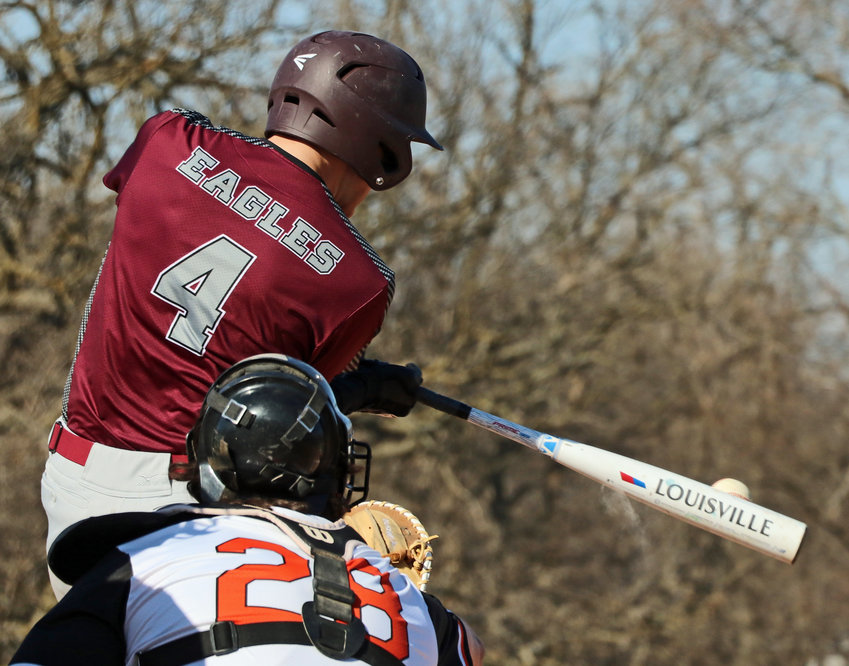 Arlington batter Trevor Denker makes contact in front of the Pioneers' Justin Myer on Thursday in Fort Calhoun.