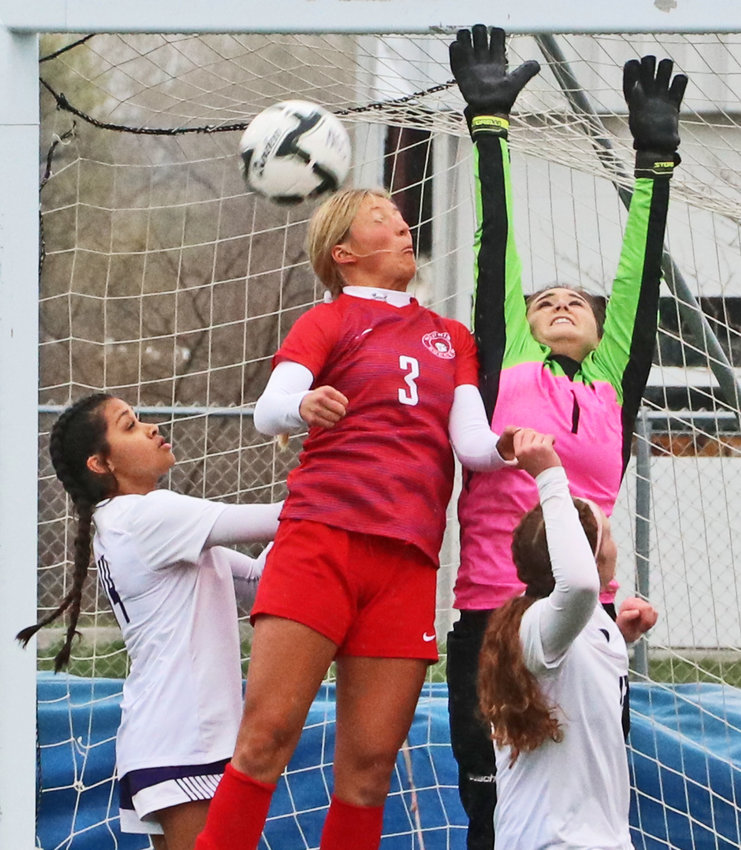 Norris' Reese Borer, middle, tries to head a corner kick as Blair's Allison Hernandez, from left, goalkeeper Sydney Campbell and Kaitlyn Johnson trie to stop her Friday at Bennington High School.