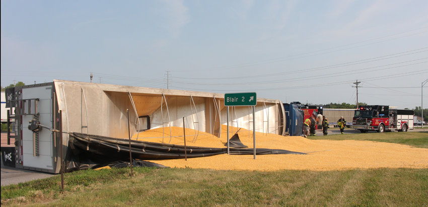 A semi-tractor trailer carrying a load of corn overturned Tuesday at the roundabout in Blair. The driver was uninjured.