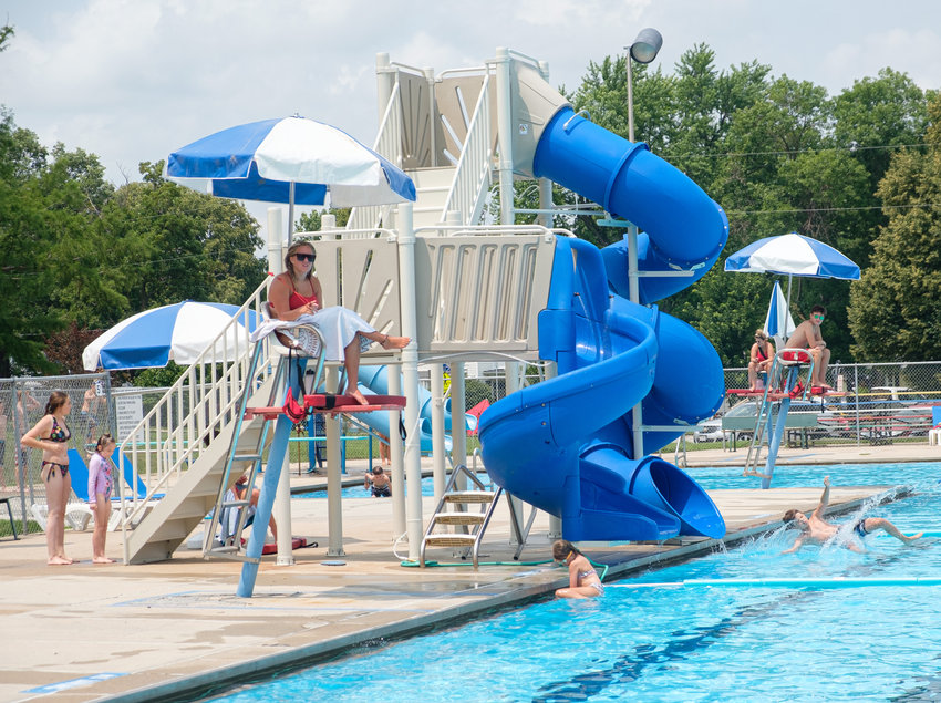 Swimmers wait in line to try out the new water slides Friday afternoon at the Blair Municipal Pool.