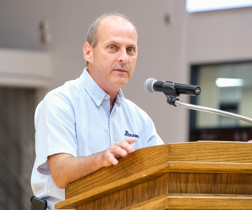 Ralph Kleinsmith with Lozier speaks Tuesday at the open house for the newly renovated industrial arts center at Blair High School. Lozier donated equipment for the project.