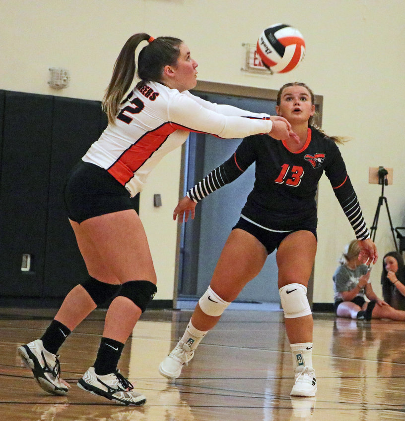 The Pioneers' Mollie Dierks, left, makes a play on the ball in front of Tilden Nottleman on Thursday at Fort Calhoun High School.