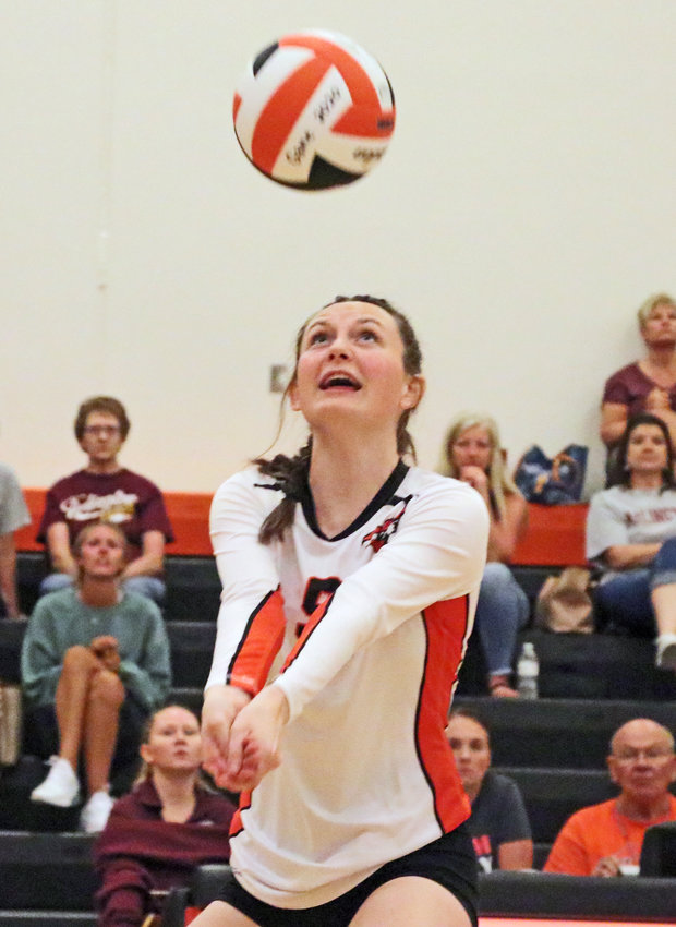 The Pioneers' Grace Genoways calls for and makes a play on the ball Thursday at Fort Calhoun High School.