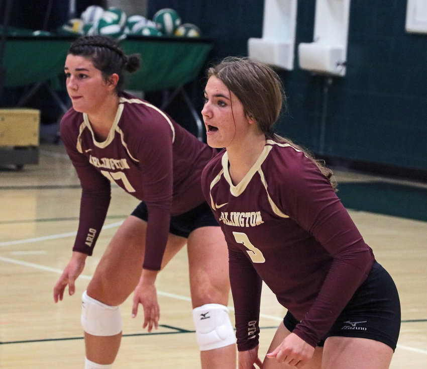 Arlington's Taylor Arp, left, and Peyton Timm wait on a Knight serve Tuesday at Fremont Bergan.