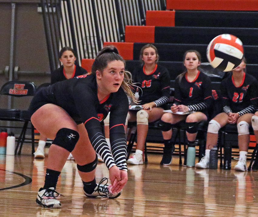 The Pioneers' Mollie Dierks gets low for a dig Saturday at Fort Calhoun High School.