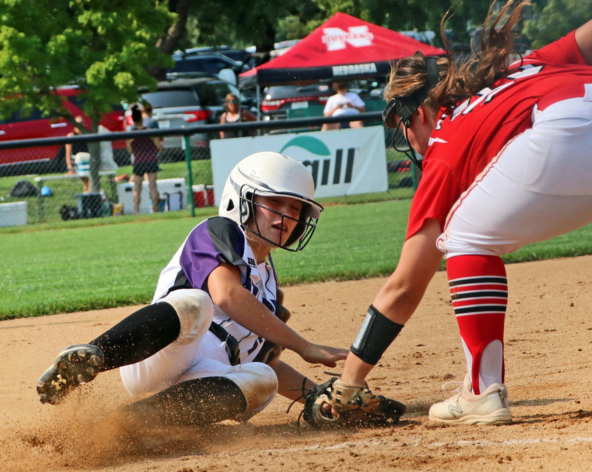Blair pinch-runner Audie Keeling slides in safe at third base against Elkhorn on Saturday at the Youth Sports Complex.