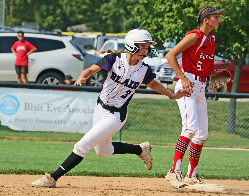 Blair base runner Leah Chance, middle, looks back to first base as she rounds second Saturday at the Youth Sports Complex.