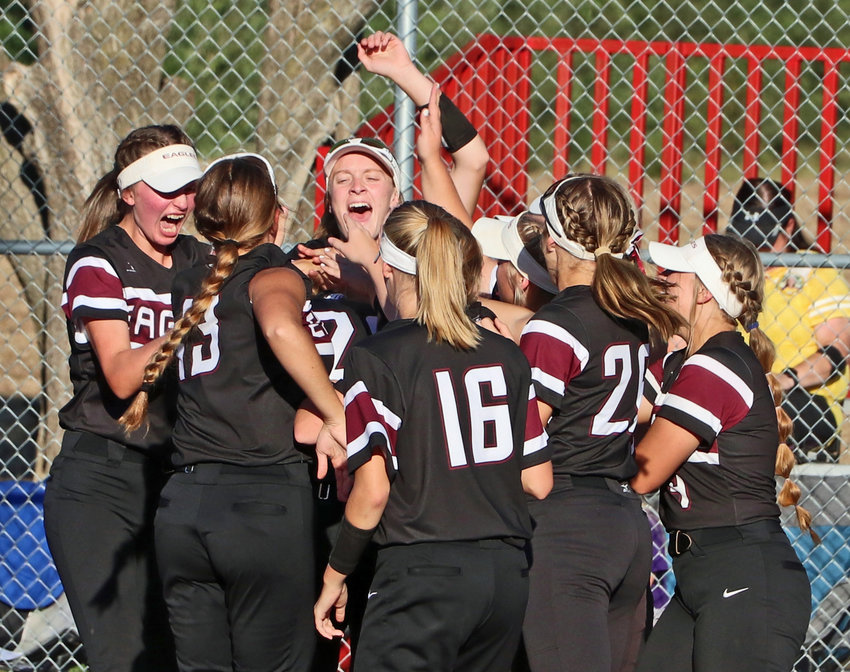 The Arlington Eagles celebrate Gracie Herman's first home run at home plate Monday in Yutan.