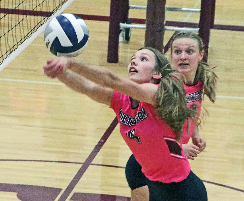 Eagles sophomore Lizzie Meyer, right, looks over her shoulder as Kailynn Gubbels makes a play on the ball Tuesday at Arlington High School.