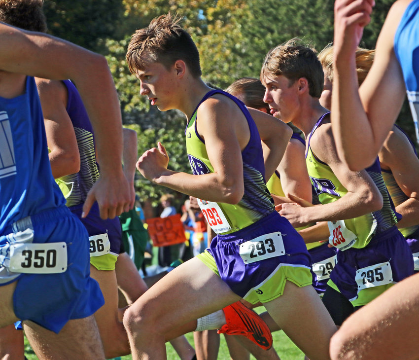 Blair state medalist Dawson Fricke, middle, runs in a pack at the start of the Class B boys race Friday at Kearney Country Club.