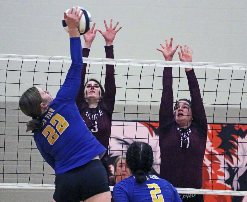 Arlington's Janessa Wakefield, left, and Taylor Arp attempt to block a spike from Logan View's Sophia Vacha on Monday at North Bend Central.