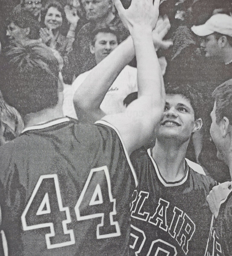 Blair's Colton Peterson gives teammate Pete Reynolds a high-five as the clock winds down during the Bears' win against Elkhorn during a 2004 district finals game.