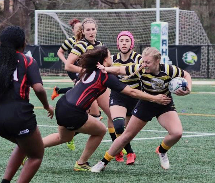 Fort Calhoun graduate Lauren Nelson, right, will close out her Wayne State rugby career Dec. 4-5 during the National Collegiate Rugby Final Four in Knoxville, Tenn.