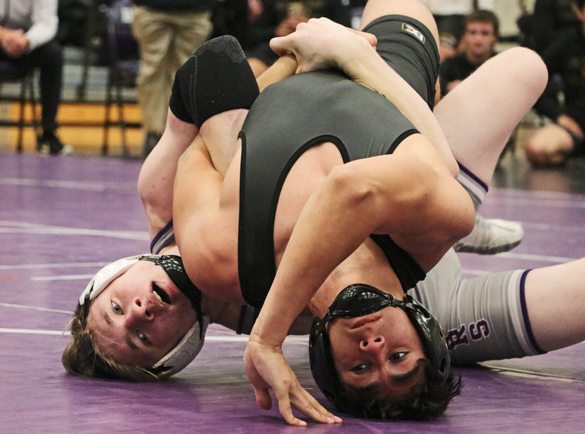 Bears 160-pounder Charlie Powers, left, scores back points Thursday during a win against Fremont's Justin Leon at Blair High School.