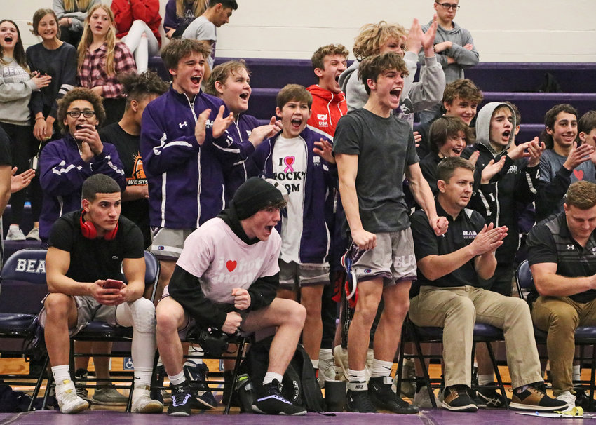 Bears react to a teammate's win on the mat Thursday at Blair High School.
