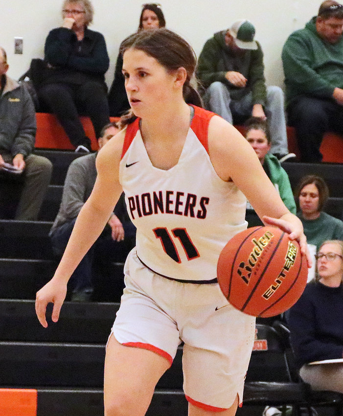 Pioneers sophomore Maddy Tinkham dribbles up the floor Saturday at Fort Calhoun High School.