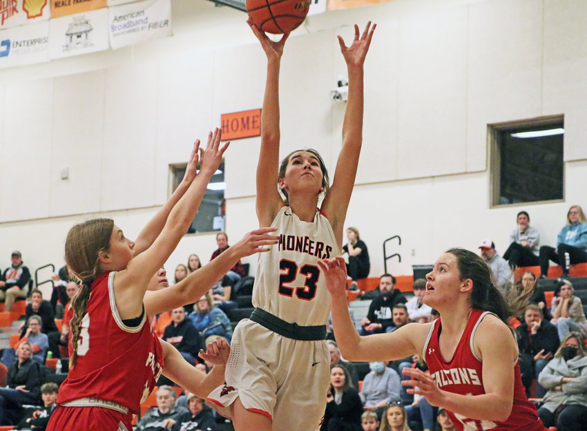 Pioneers sophomore Bria Bench, middle, puts up a shot between Douglas County West defenders on Thursday at Fort Calhoun High School.