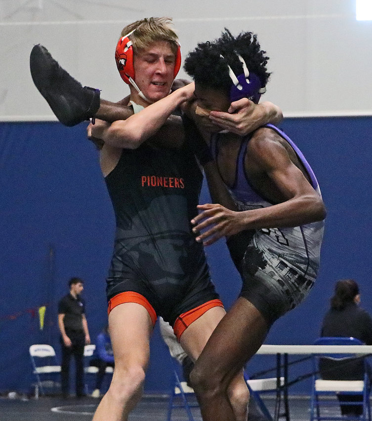 Fort Calhoun 126-pounder Ely Olberding, left, pinned Omaha Central's Jordyn Brookins in 16 seconds Saturday at Boys Town.