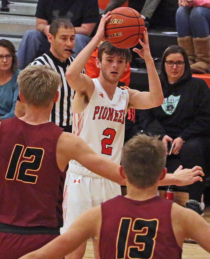 The Pioneers' Owen Newbold, facing, looks for a passing lane Monday at Fort Calhoun High School.