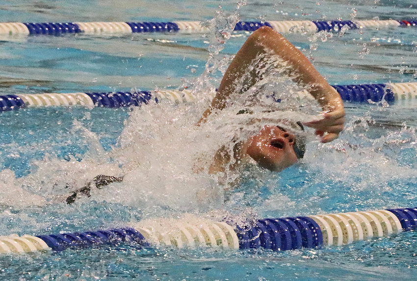 Arlington's Cade Arnett swims Tuesday in Fremont.