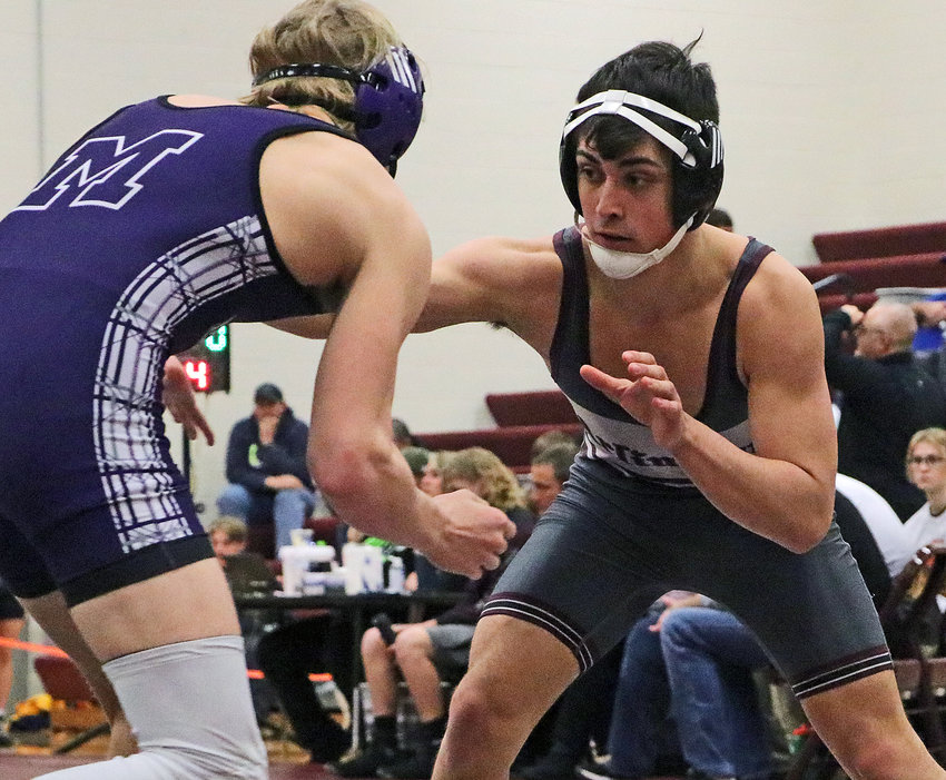 Eagles 170-pounder Cade Podany, right, faces off against Milford's Christopher Scdoris on Saturday at Arlington High School.
