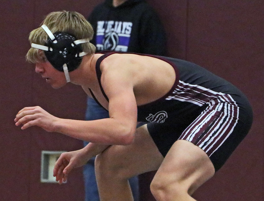 The Eagles' Stokely Lewis competes Saturdy at Arlington High School.