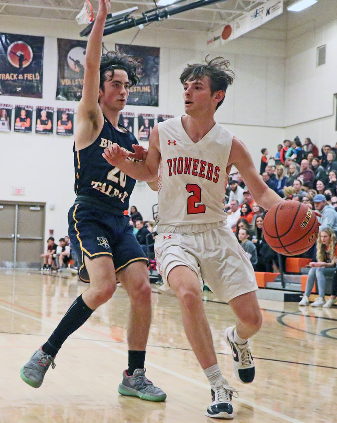 Pioneers senior Owen Newbold, right, dribbles as Omaha Brownell-Talbot's Chris Schinzel defends Tuesday at Fort Calhoun High School.